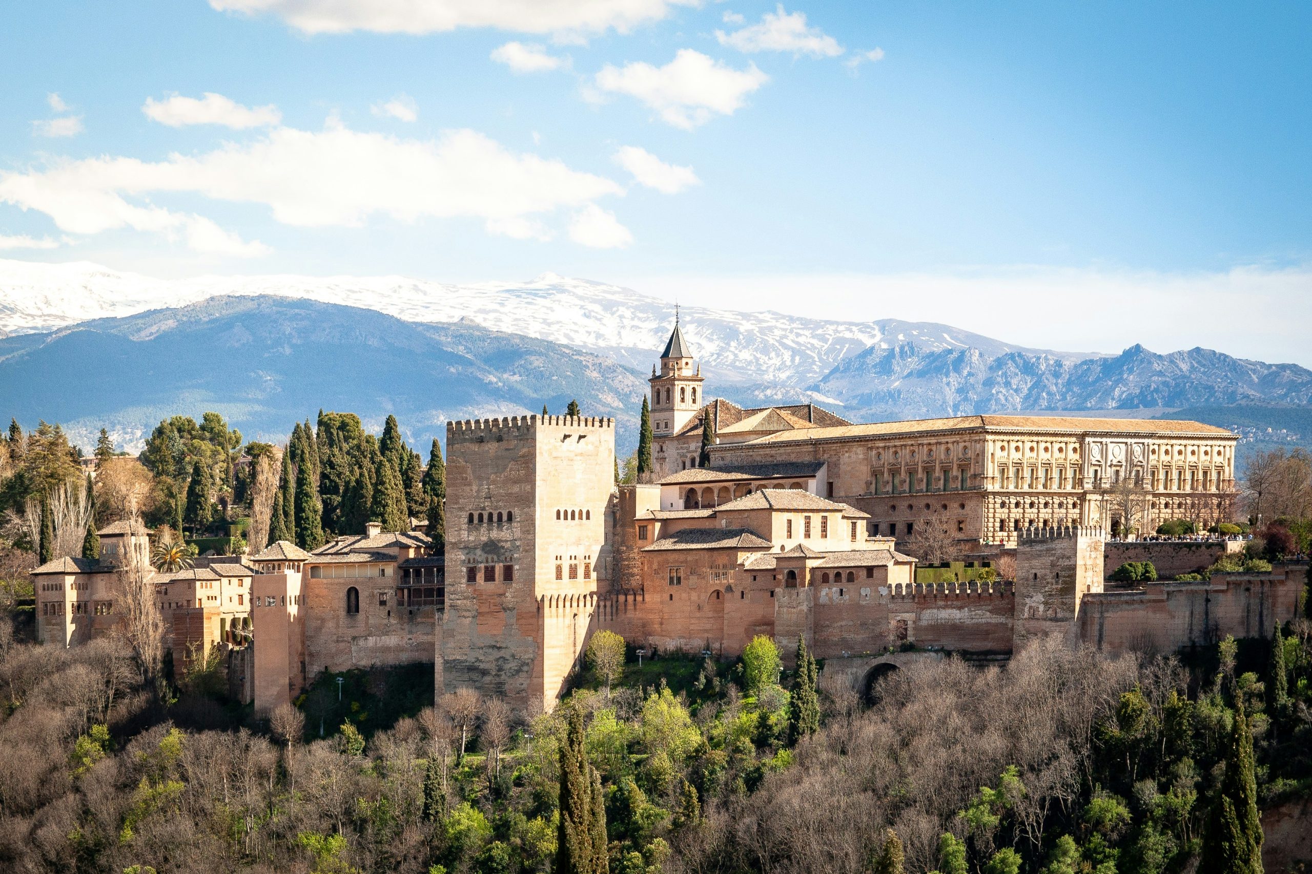 Alhambra palace in spring, Granada, Spain. In early April the mountains are still covered in snow